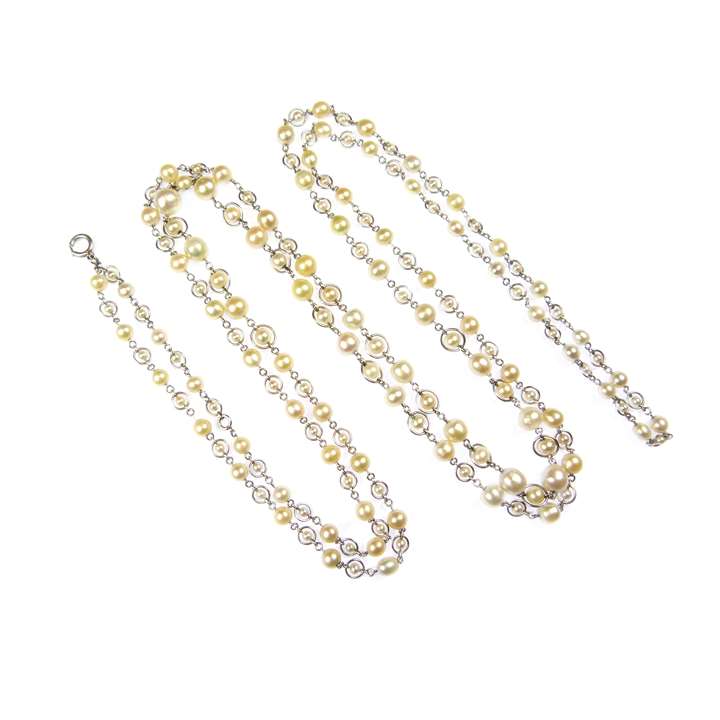 Early 20th century pearl and platinum long chain necklace